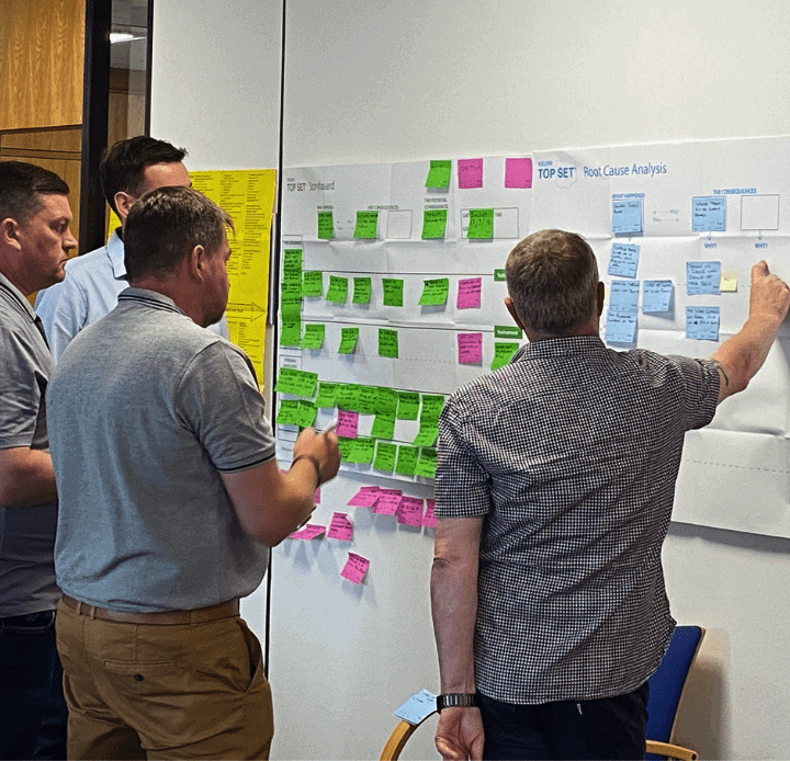 Delegates constructing root cause analysis diagram